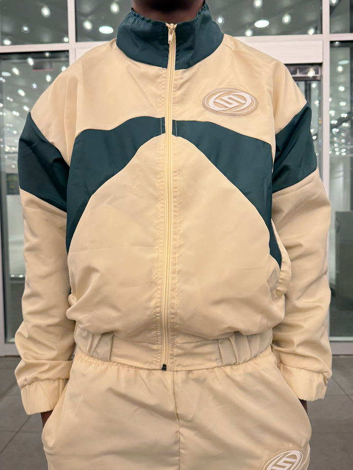 Beige and green winter jacket with brand logo on a neutral background